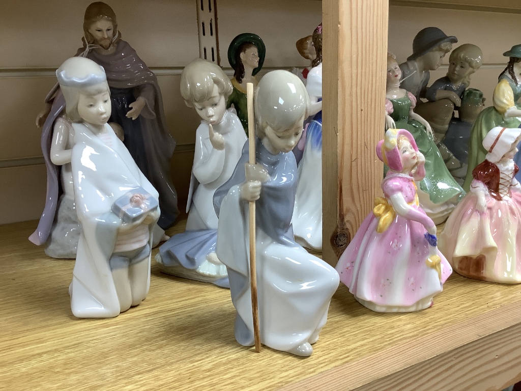 A group of ceramic figurines, various